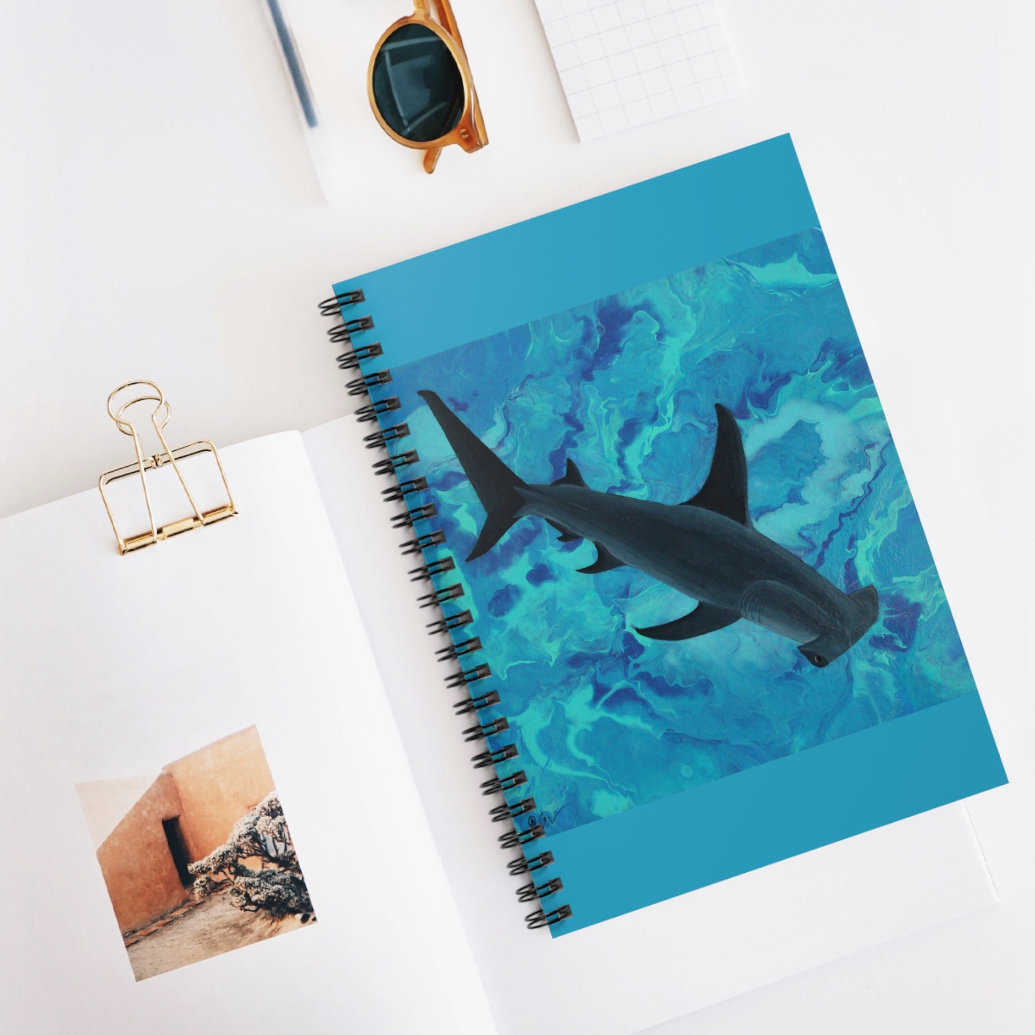 Spiral Journal on desk with image of hammerhead shark in turquoise sea