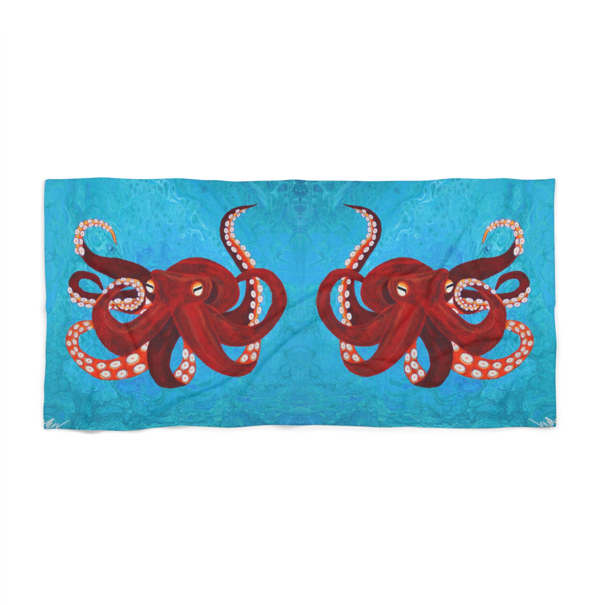 Towel/blanket with red octopus design on a blue background
