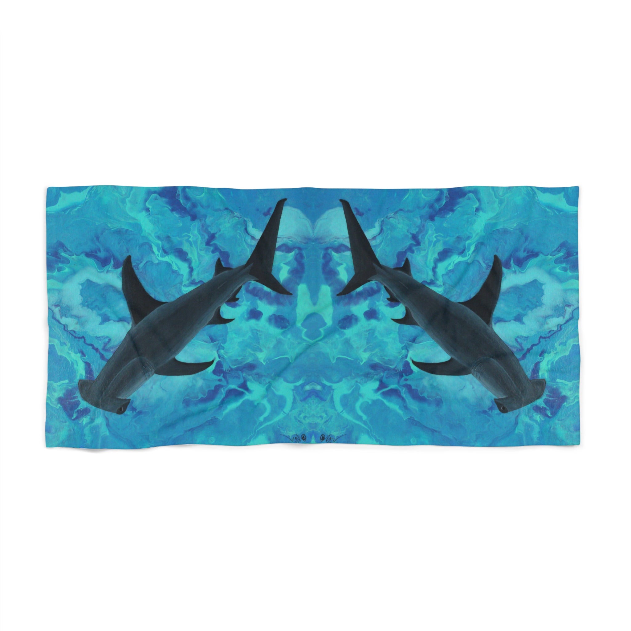 Towel/blanket with hammerhead shark design on a blue watercolor background