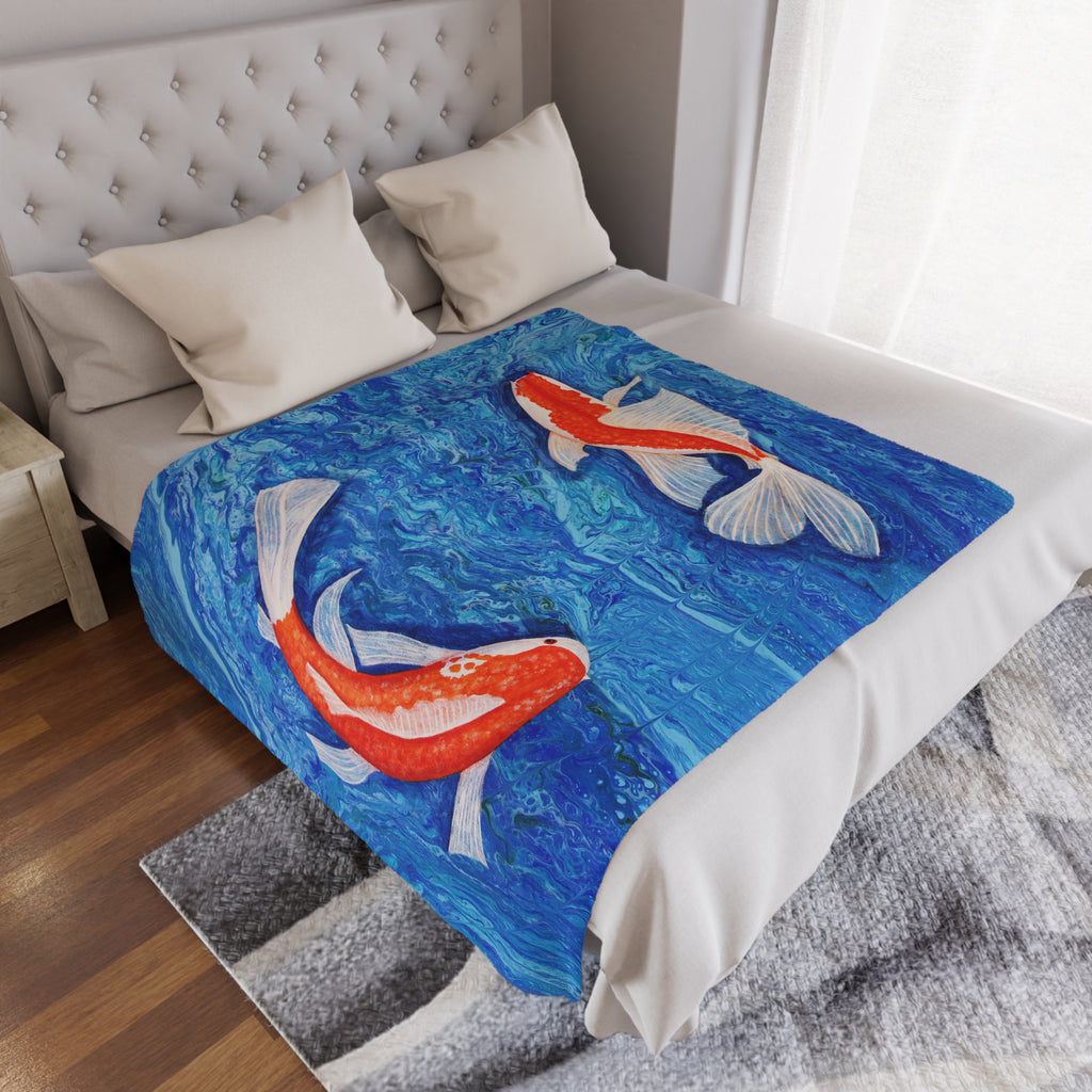 Bed with a decorative blanket featuring koi fish design in a bedroom setting.