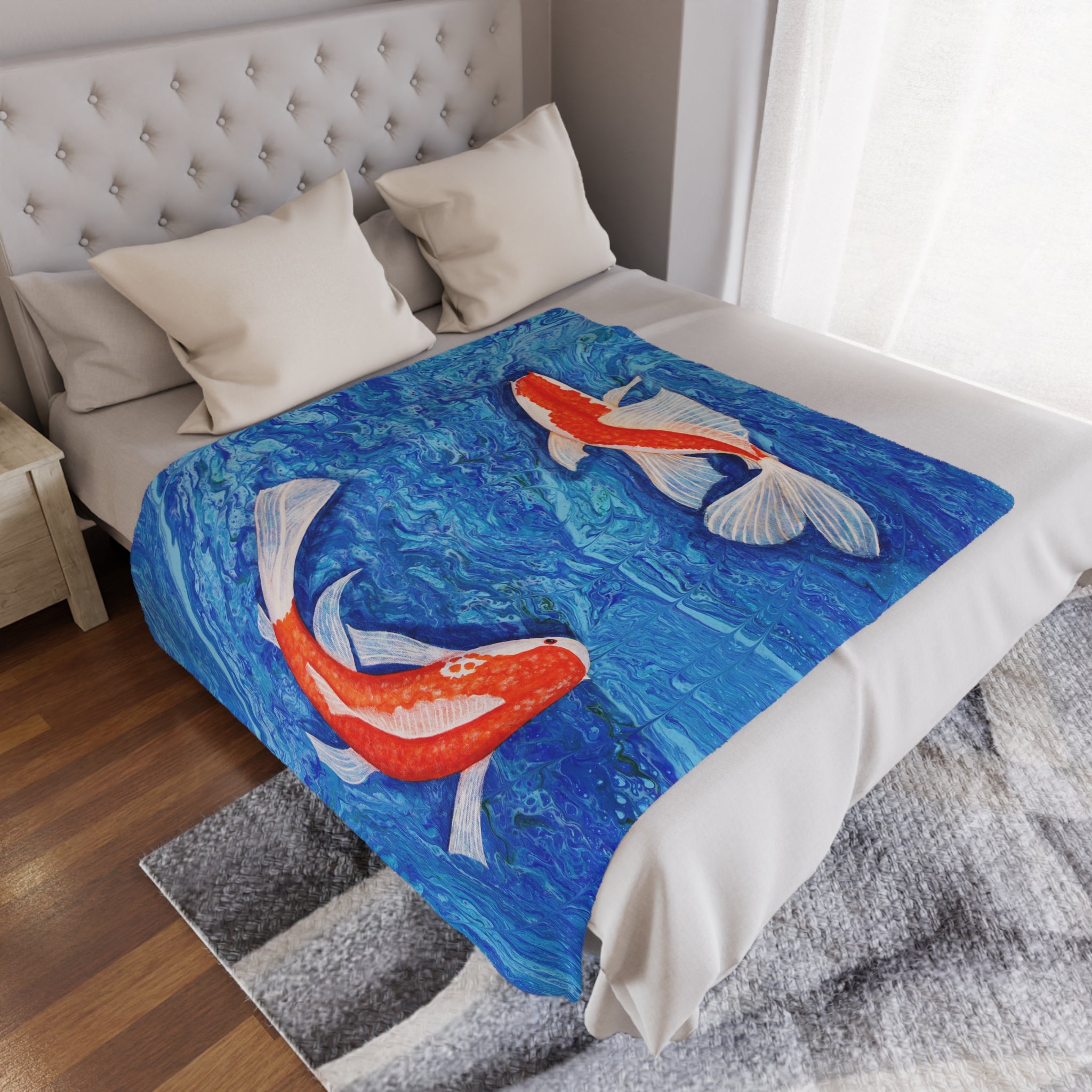 Bed with a decorative blanket featuring koi fish design in a bedroom setting.