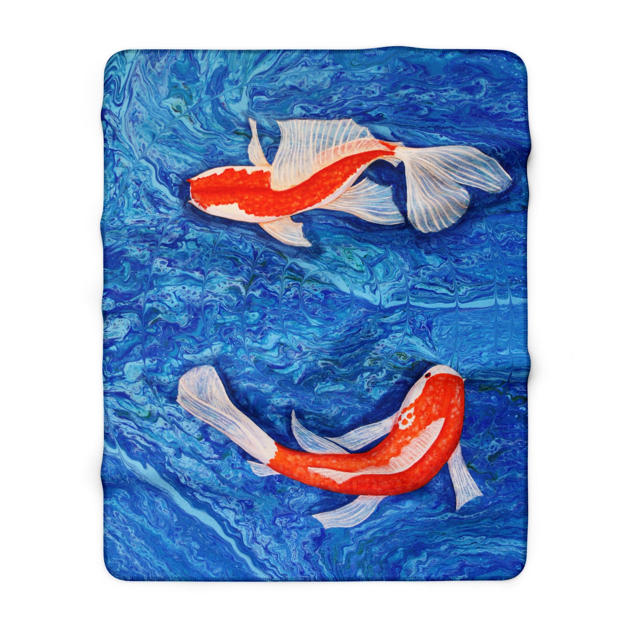 Blanket with two goldfish designs on a blue water background