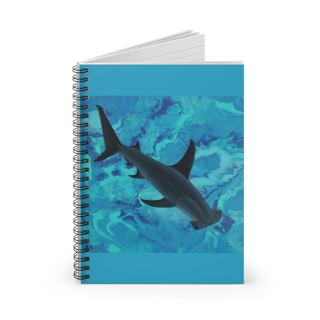 Notebook with a shark design on a blue watercolor background