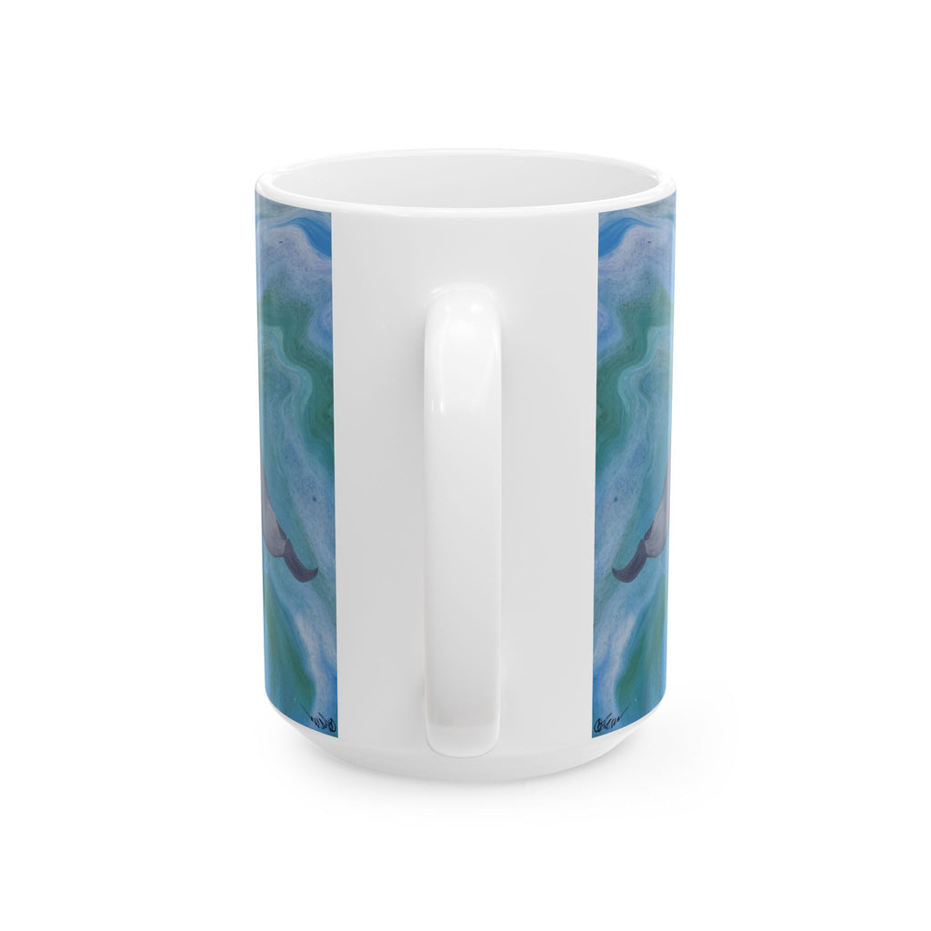 White mug with blue and green marbled design on a white background