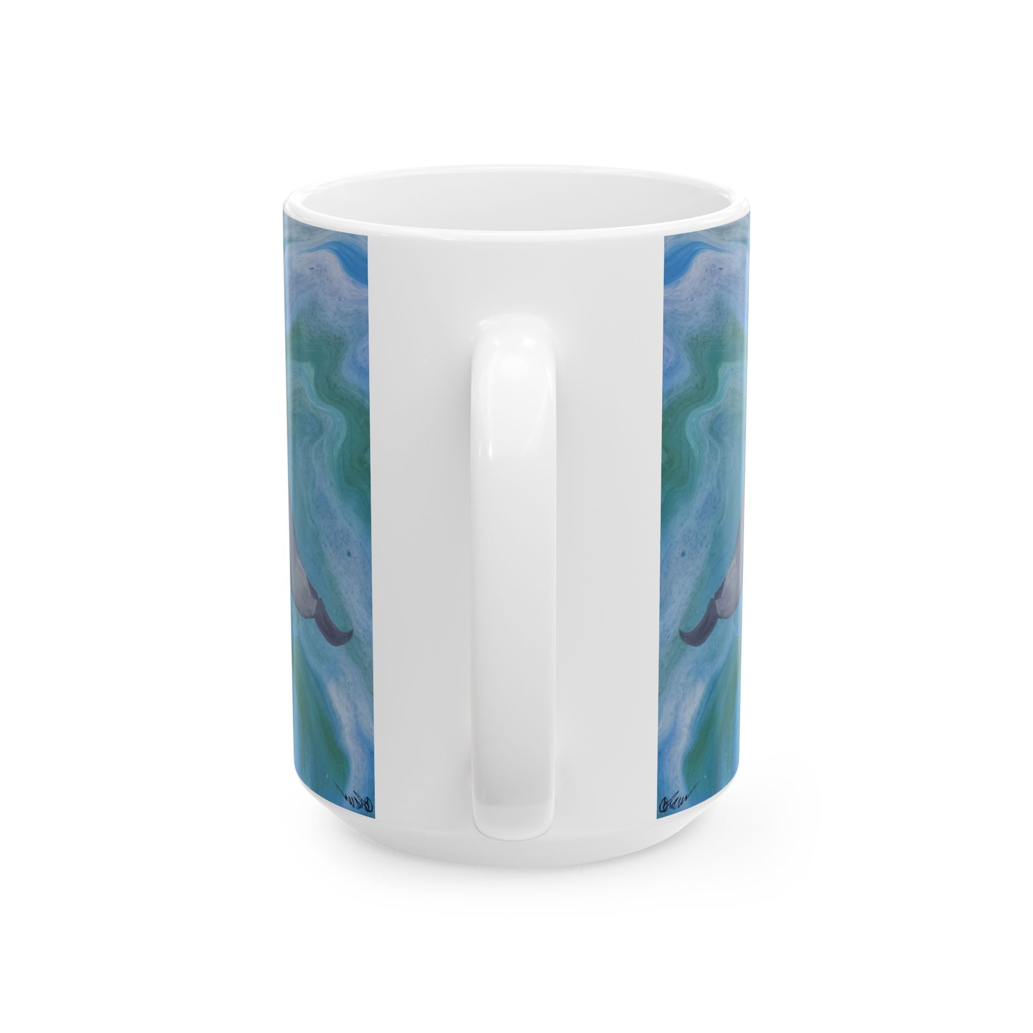 White mug with blue and green marbled design on a white background