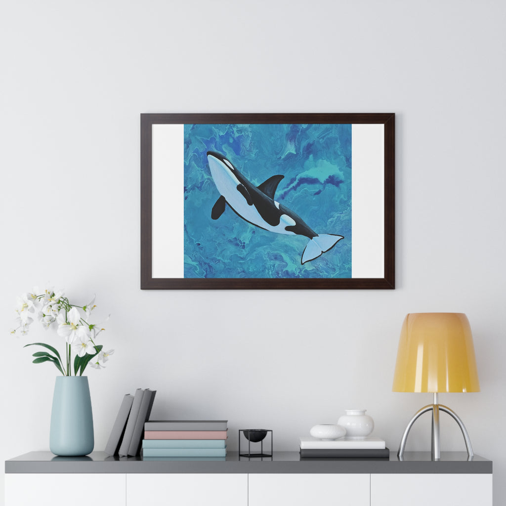 Framed artwork of a whale on a wall above a shelf with decor items.