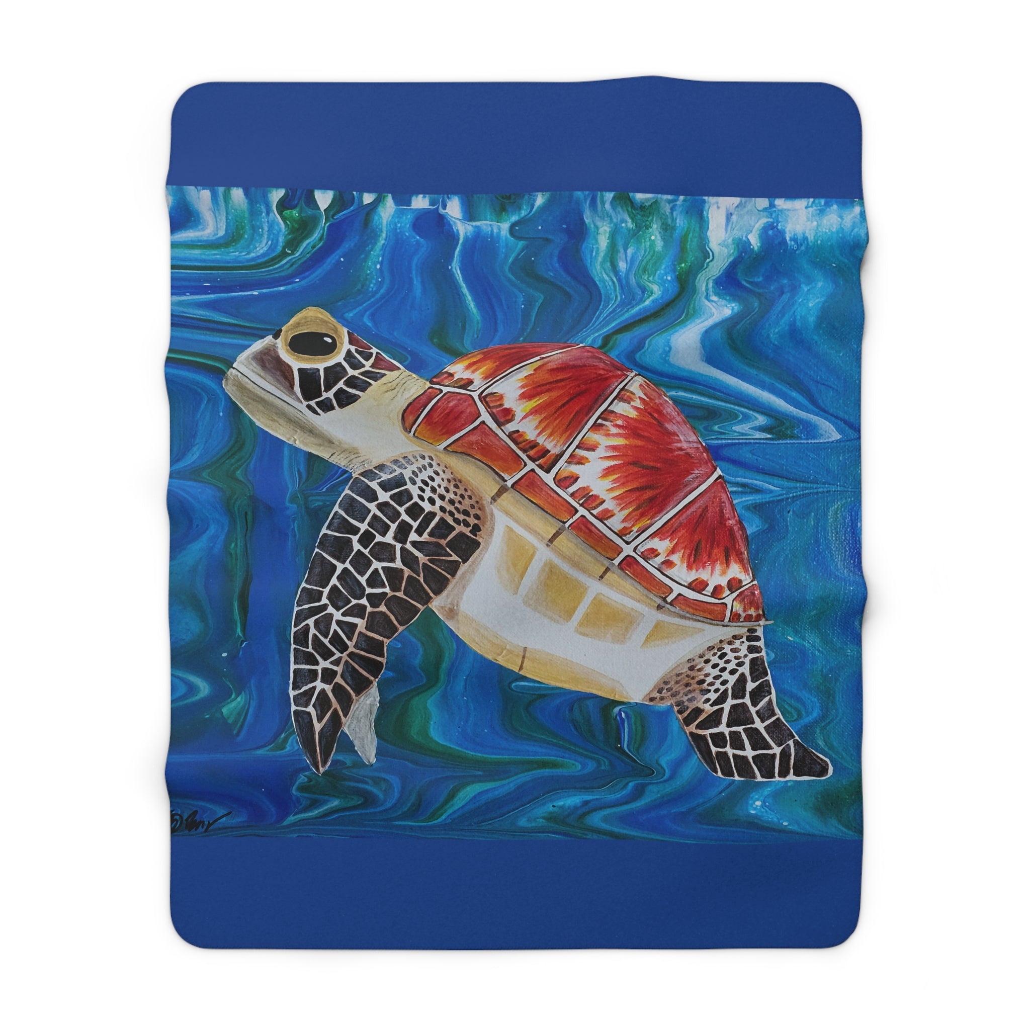 Fleece blanket with a turtle design on a blue background