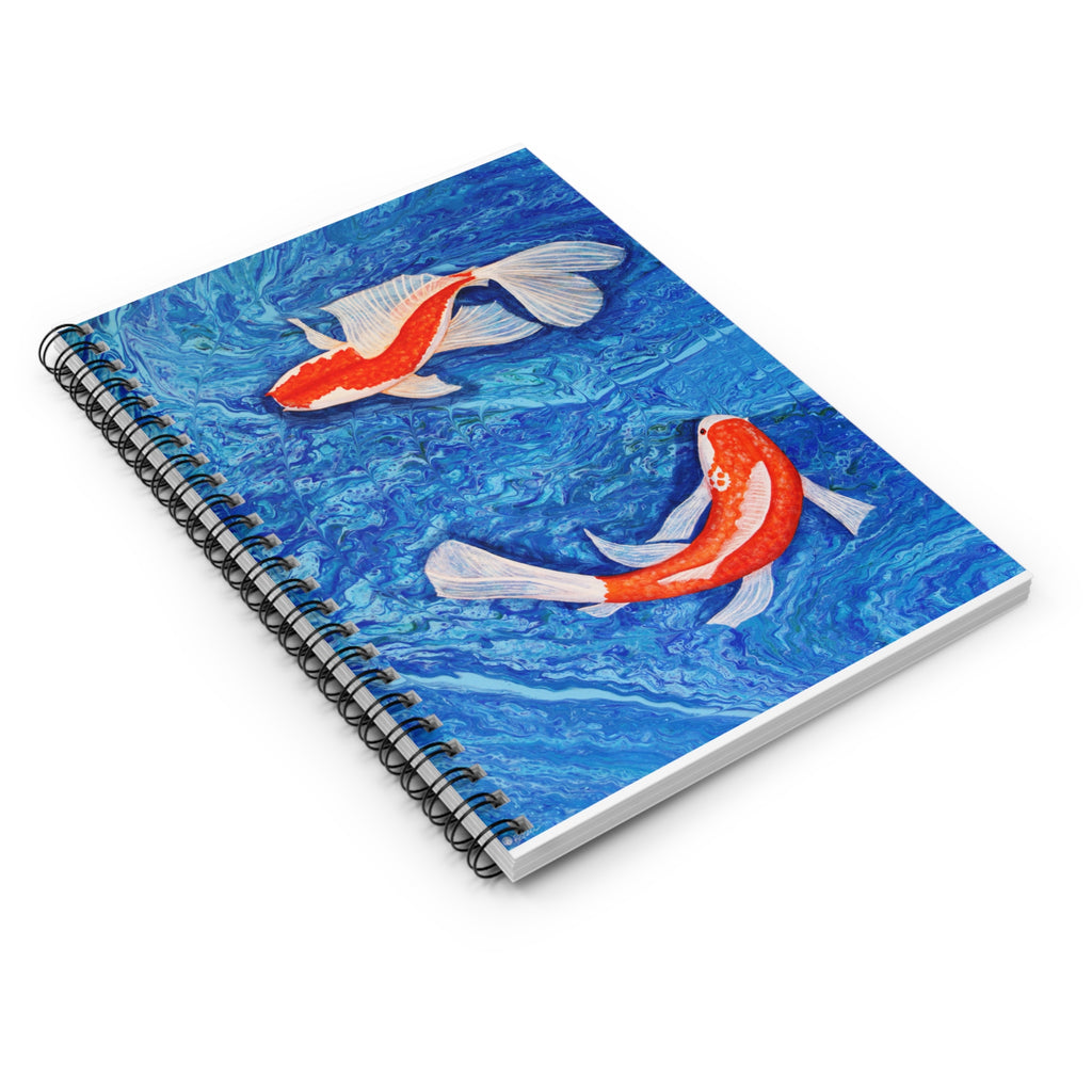 Notebook with koi fish design on a blue water background