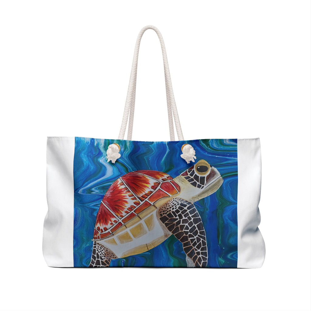 Tote bag with a turtle design on a blue and white background