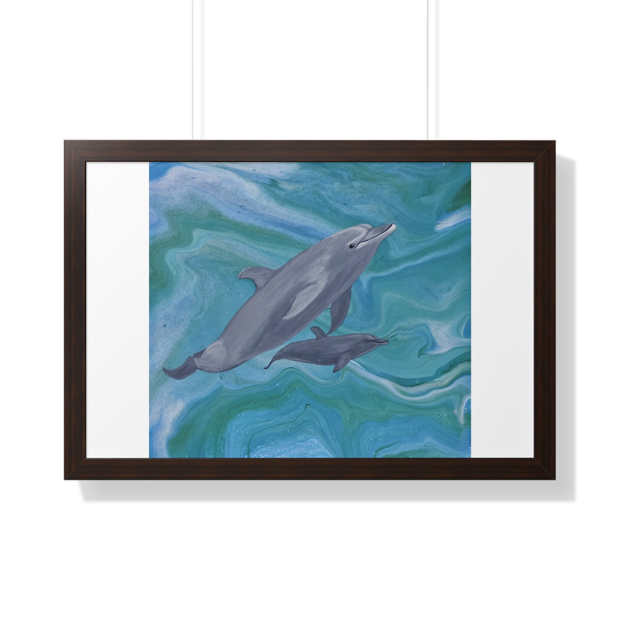 Framed artwork of two dolphins swimming in wavy blue water on a white background