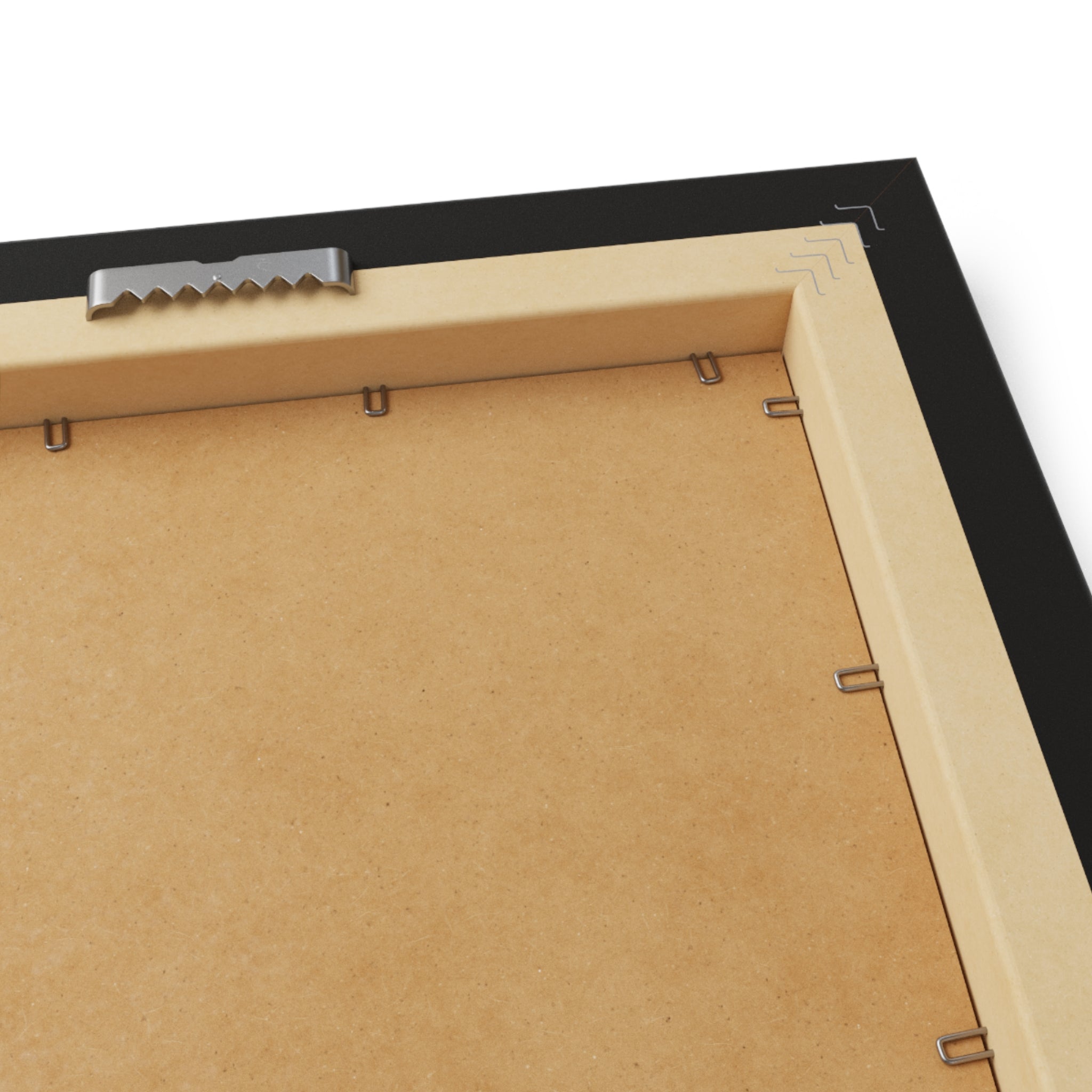 Close-up of a picture frame with a cardboard backer and metal corner bracket.