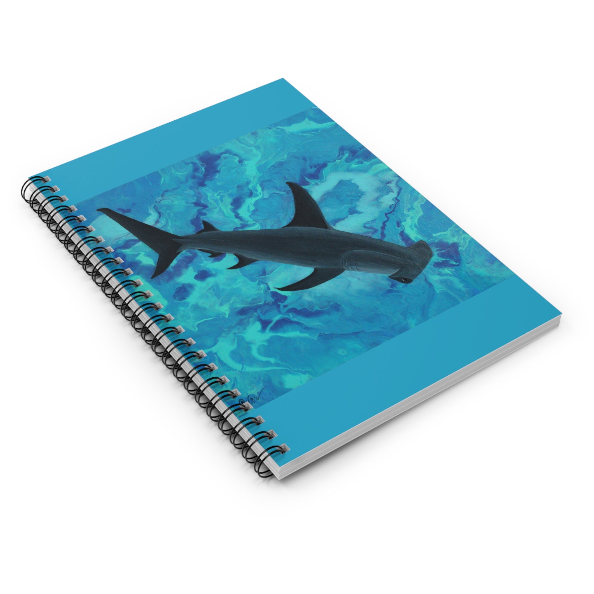 Notebook with a shark design on a blue watercolor background