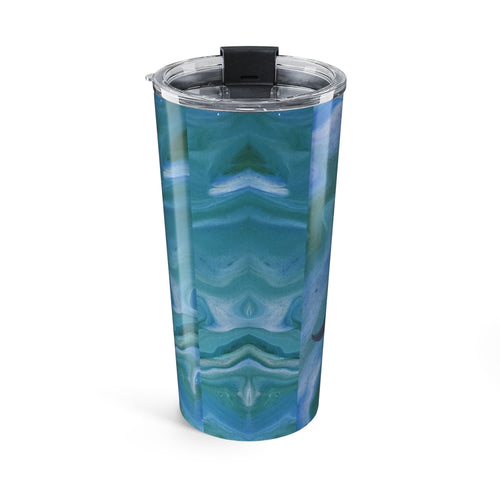 Turquoise and white patterned tumbler with a clear lid on a white background