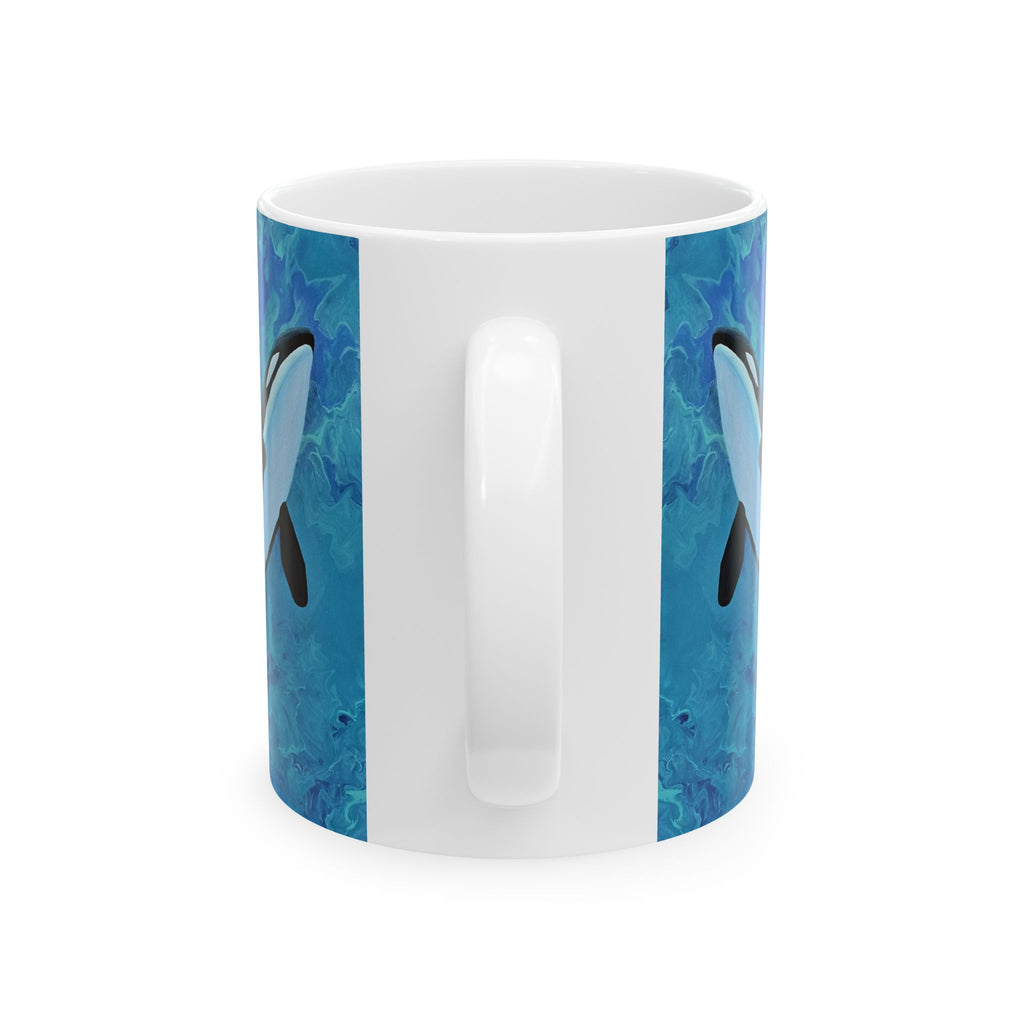 White mug with blue dolphin design on a white background