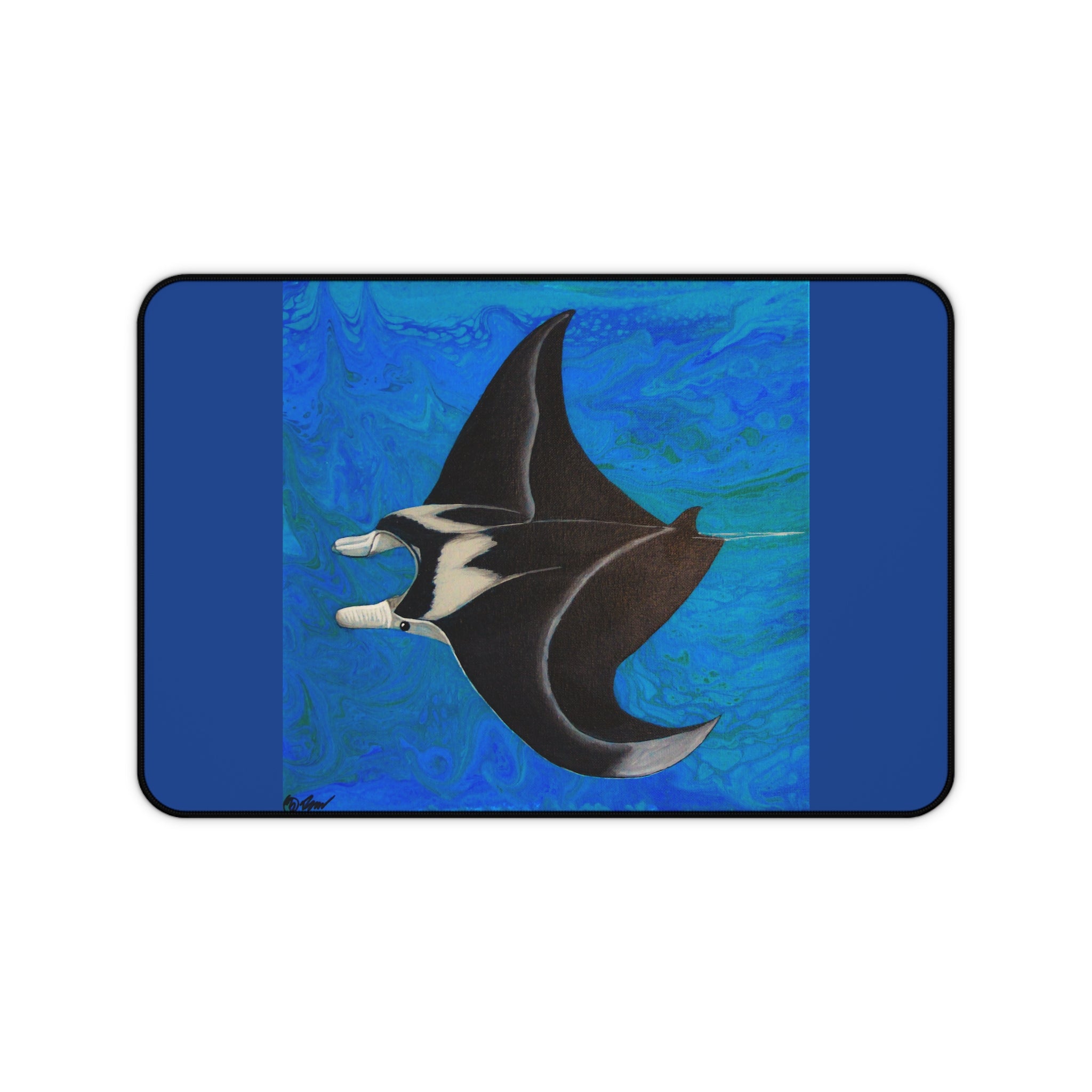 Desk pad with a manta ray design on a blue abstract background