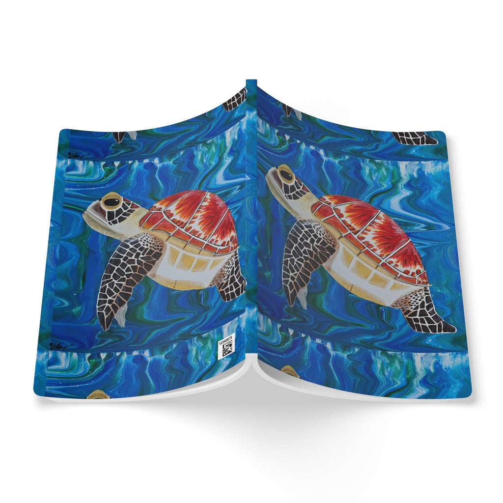 Open notebook with turtle design on a blue watercolor background