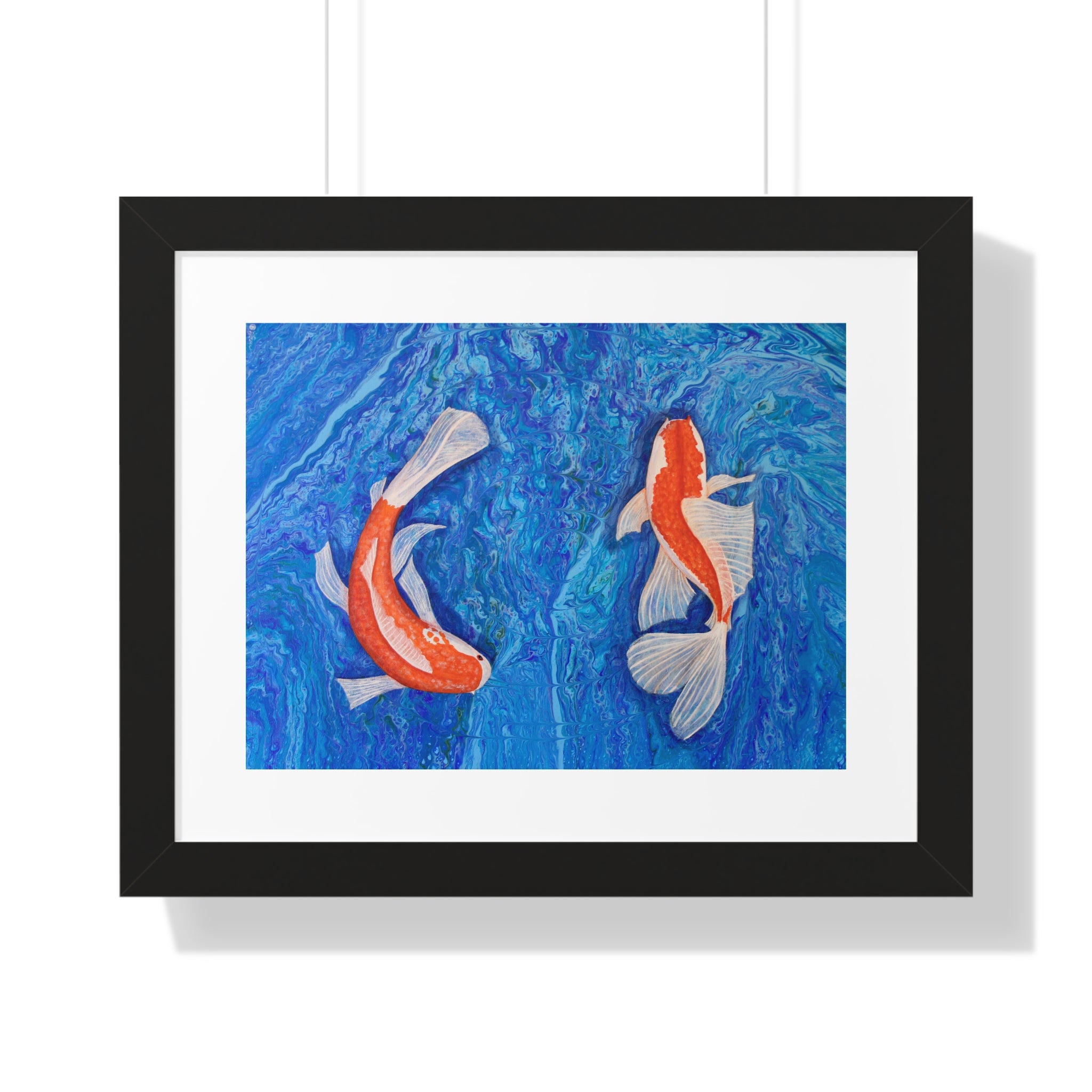 Framed artwork of two koi fish on a blue background