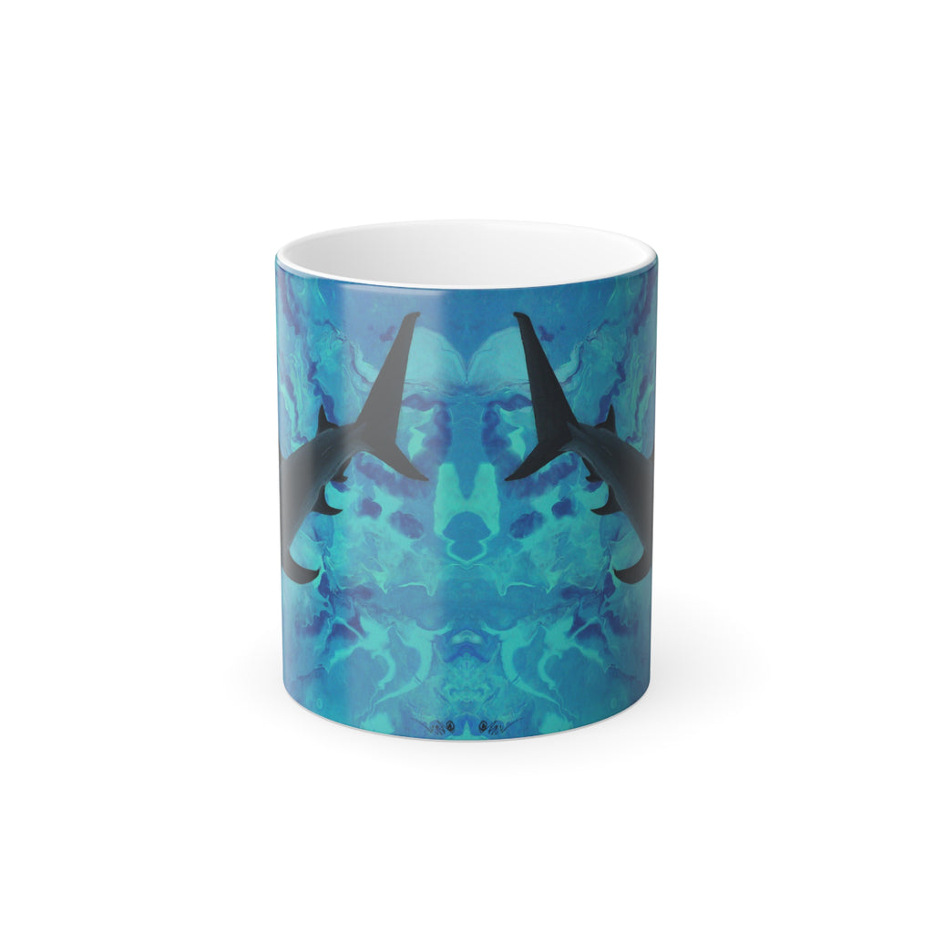 Mug with shark design on a blue and green patterned background