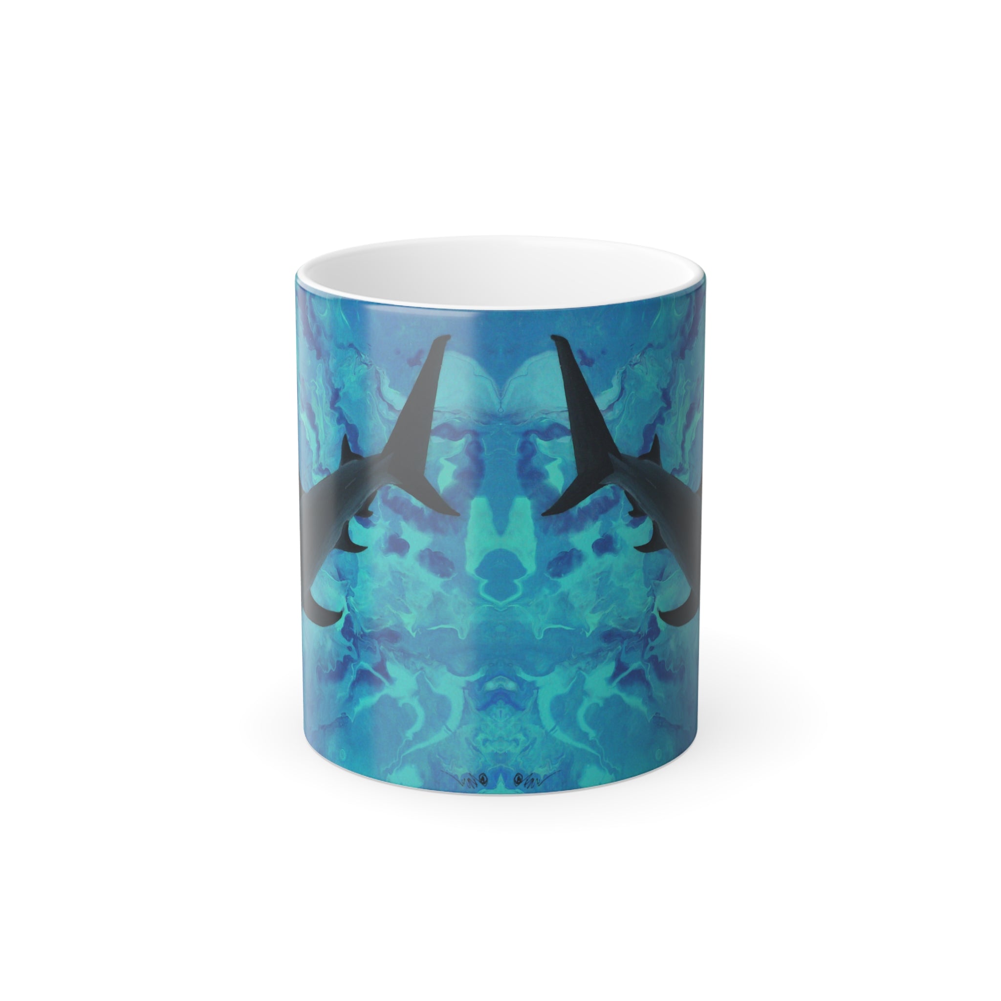 Mug with shark design on a blue and green patterned background