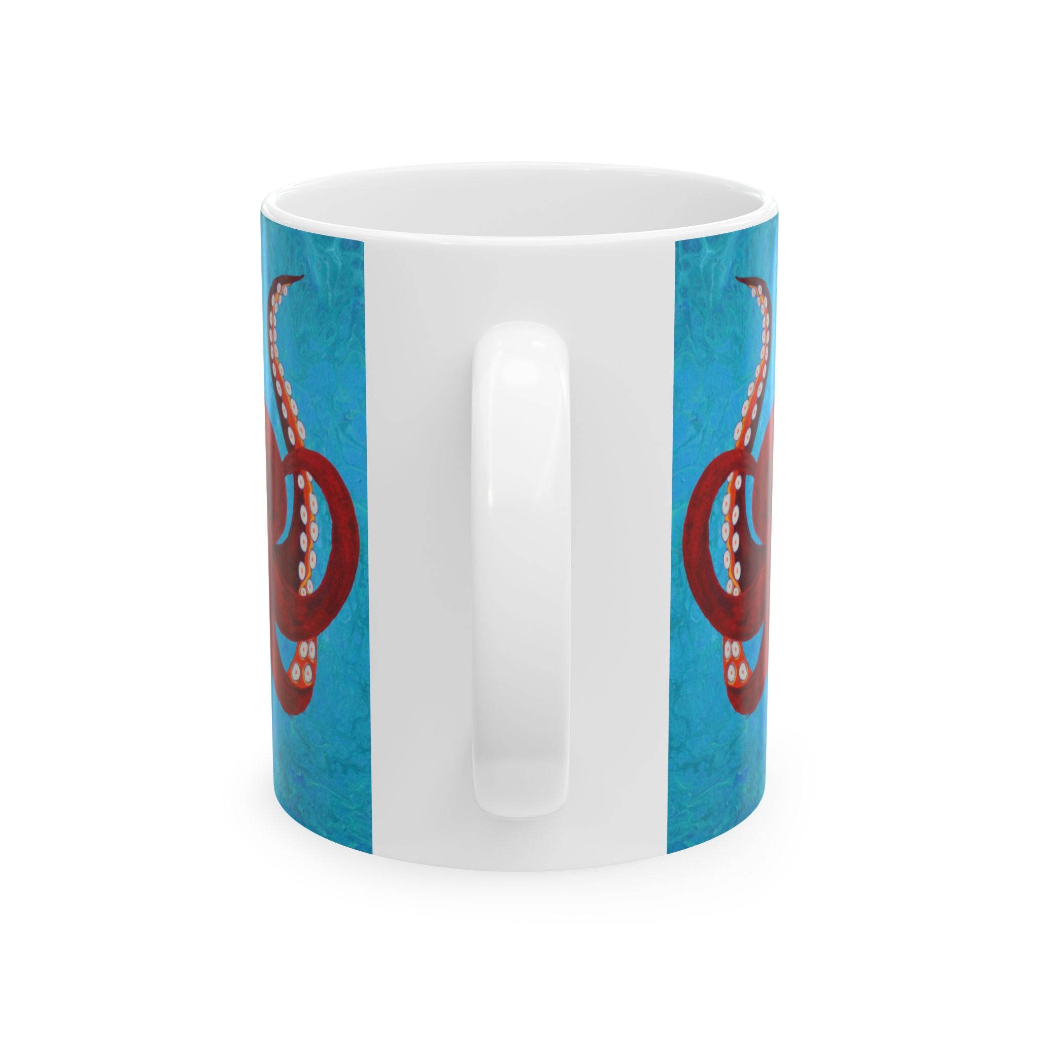 White mug with blue stripes and red circular designs on a white background