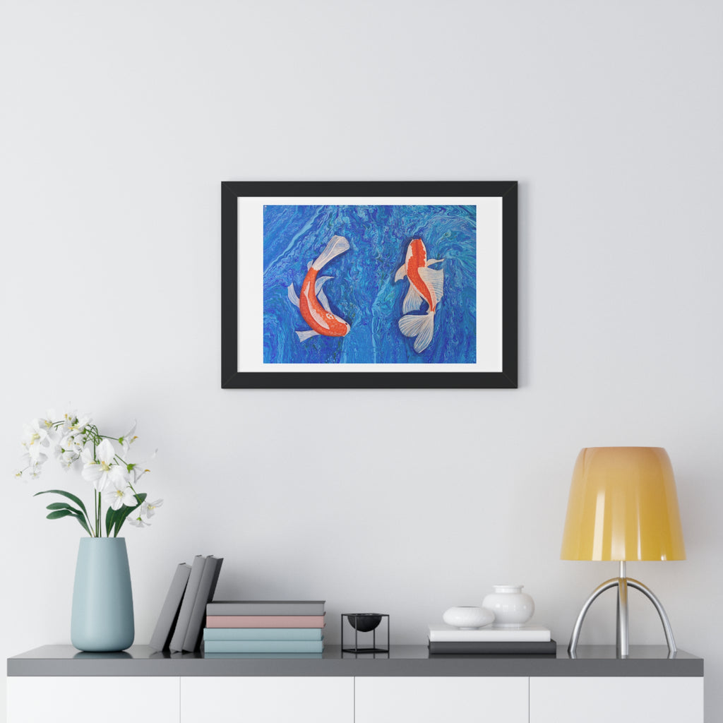 Framed artwork of two koi fish on a blue background, displayed on a wall above a shelf with decorative items.
