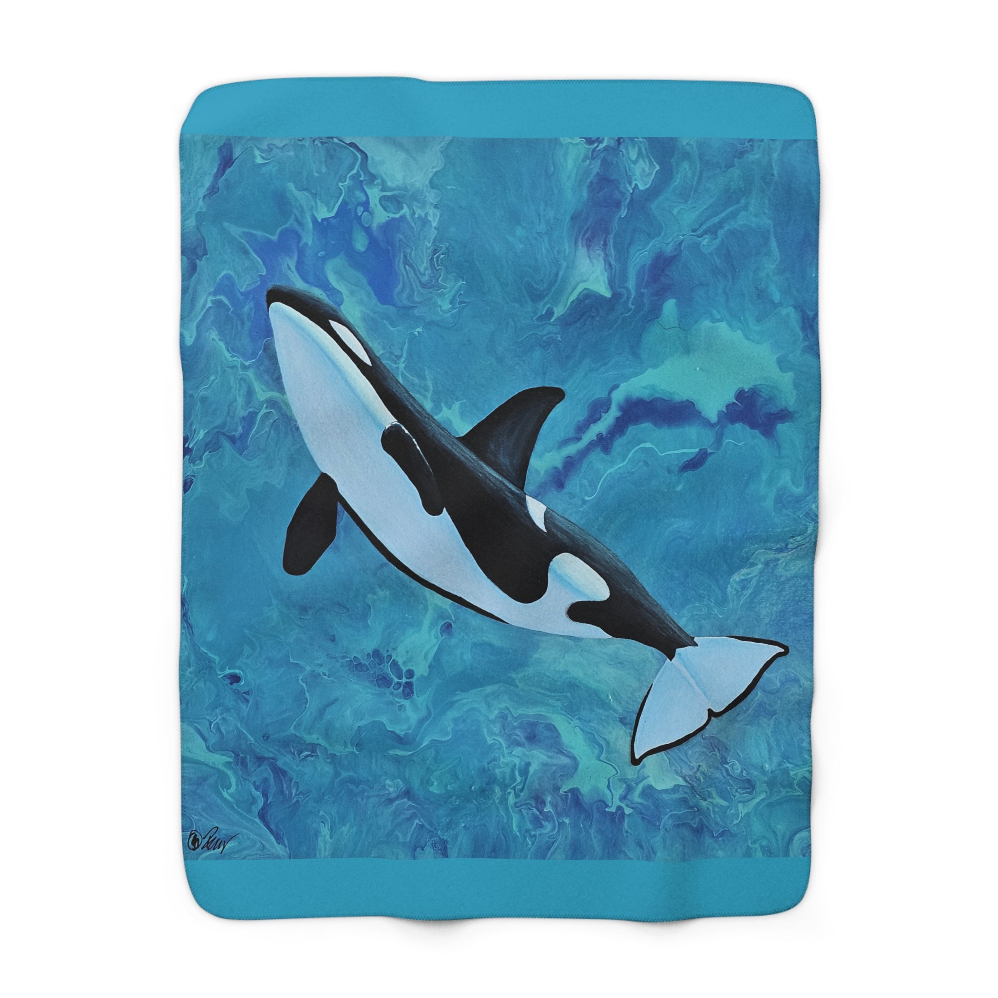 Blanket with an orca whale design on a blue and green abstract pattern