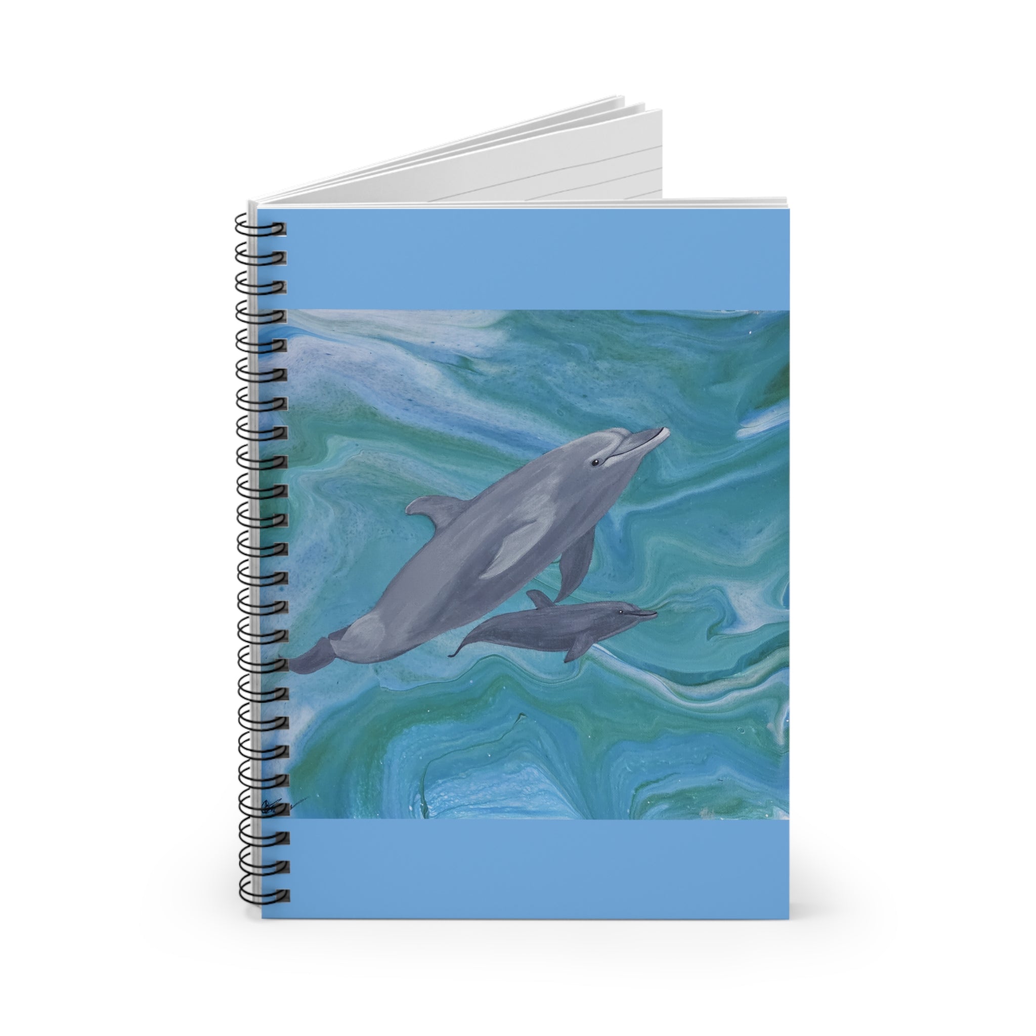Notebook with a dolphin design on a blue and green wave background