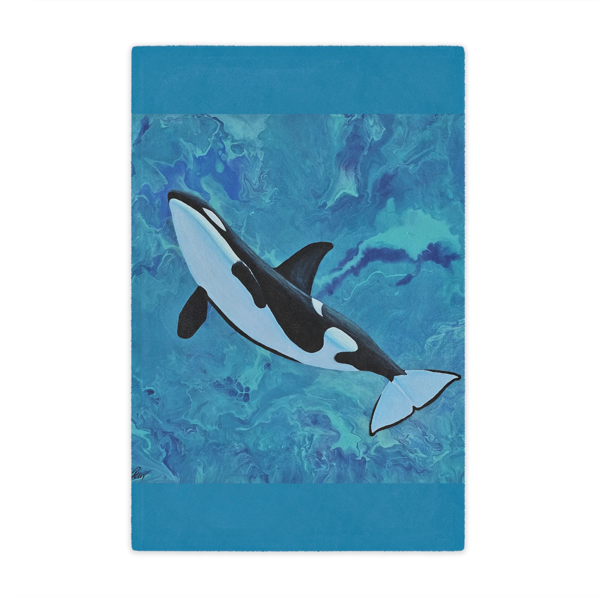 Blanket with an orca whale design on a blue watercolor background
