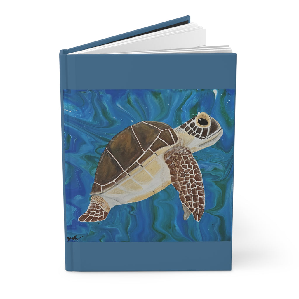 Notebook with a turtle illustration on a blue underwater background