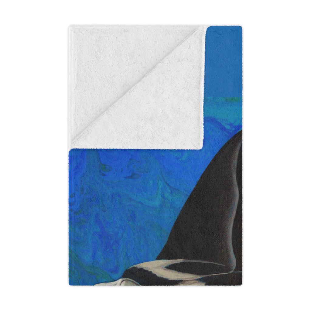 Folded blanket with blue and gray pattern on a white background