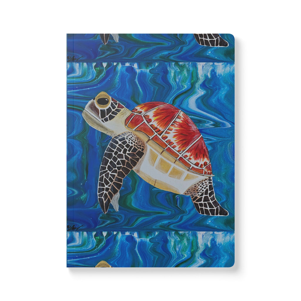 Notebook with a colorful turtle design on a blue watercolor background