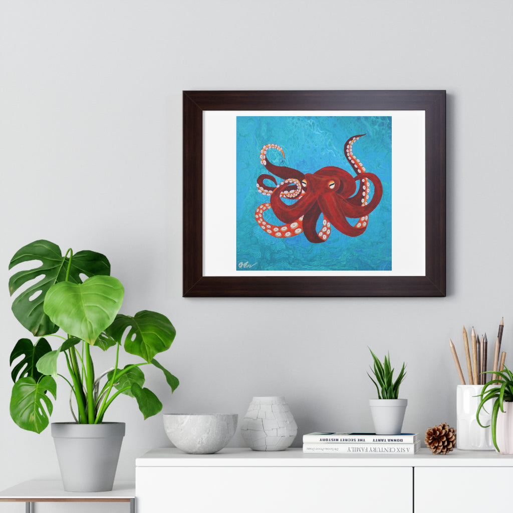 Framed artwork of a red octopus on a blue background, displayed on a wall above a white cabinet with decorative items.