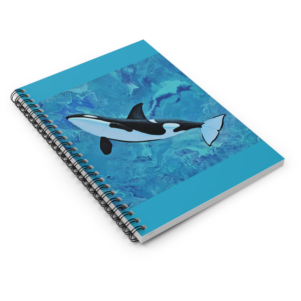 Notebook with an orca whale design on a blue watercolor background