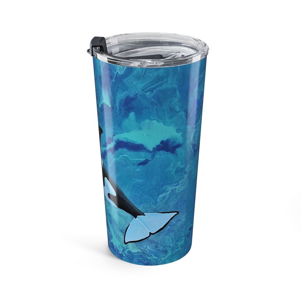 Tumbler with blue whale design on a white background