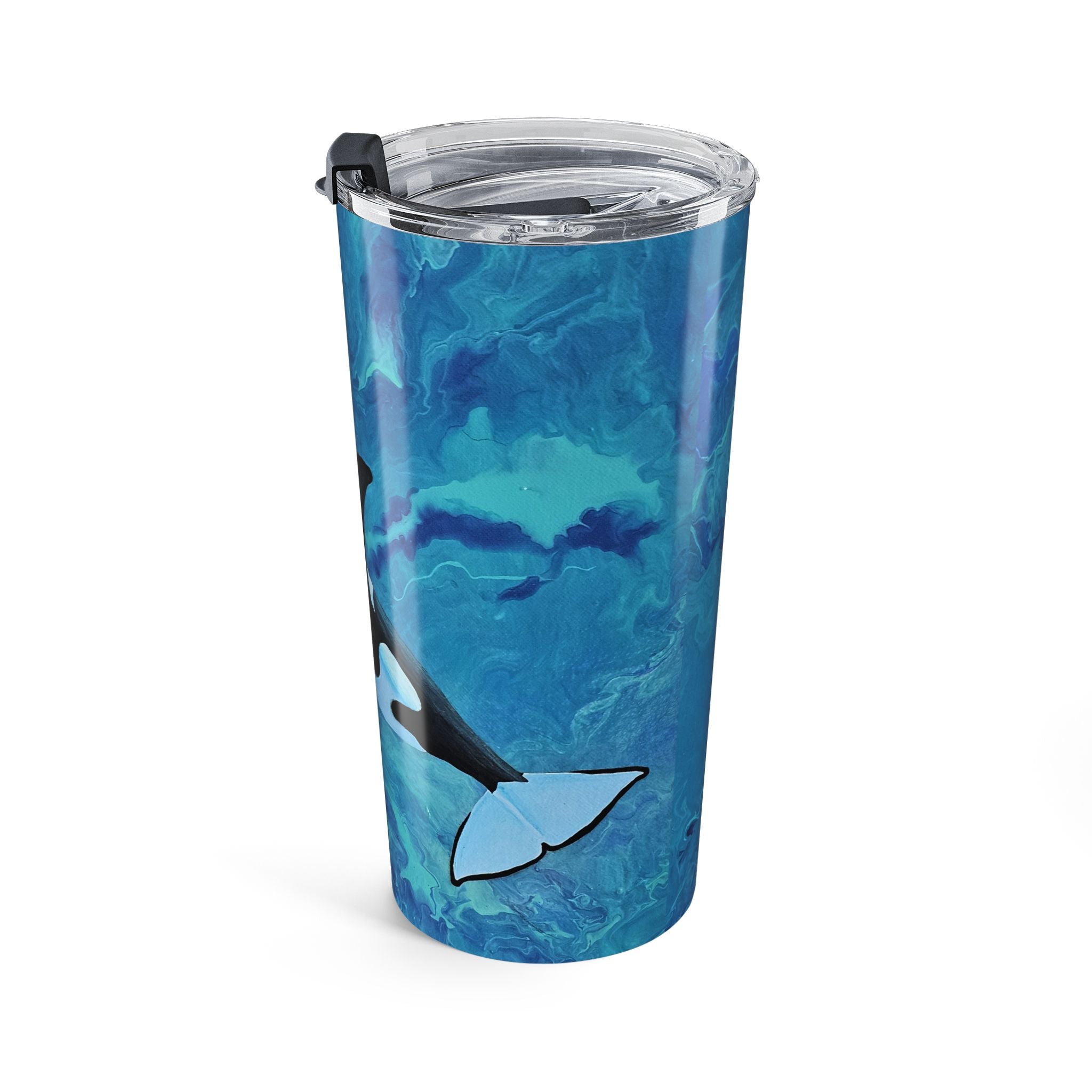 Tumbler with blue whale design on a white background