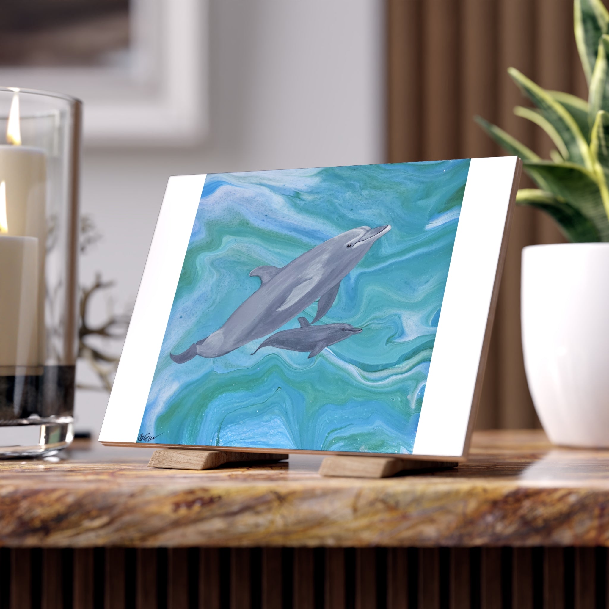 Art print of dolphins on a stand with a blurred background tile