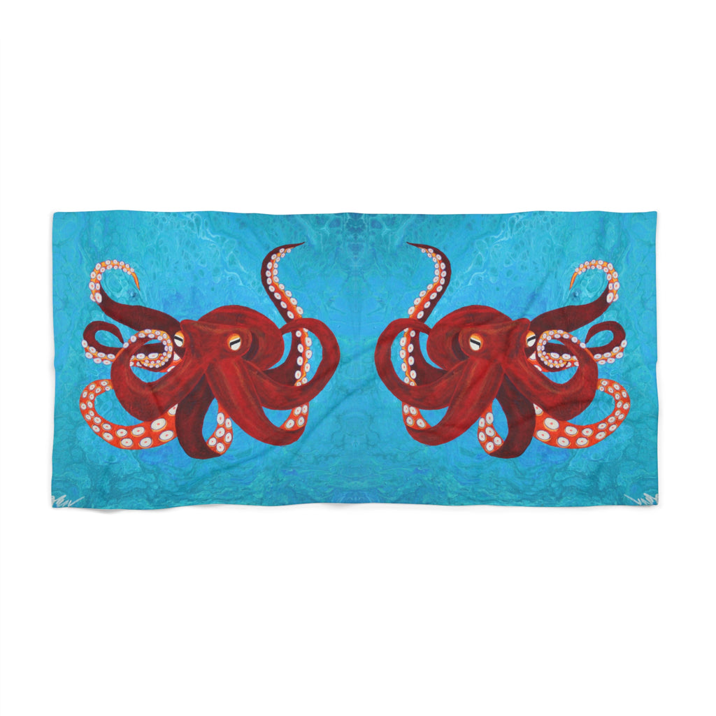 Towel/blanket with red octopus design on a blue background