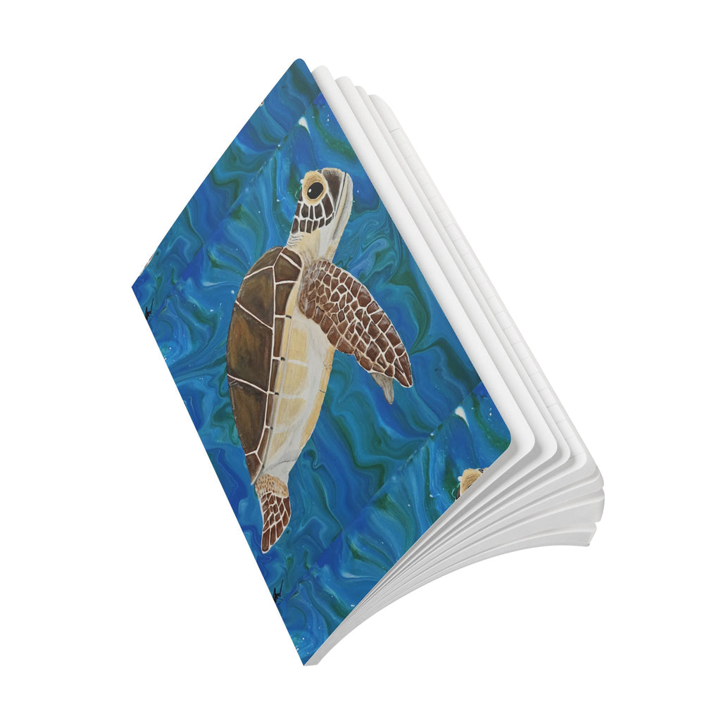 Open Notebook with a turtle design on a blue underwater background