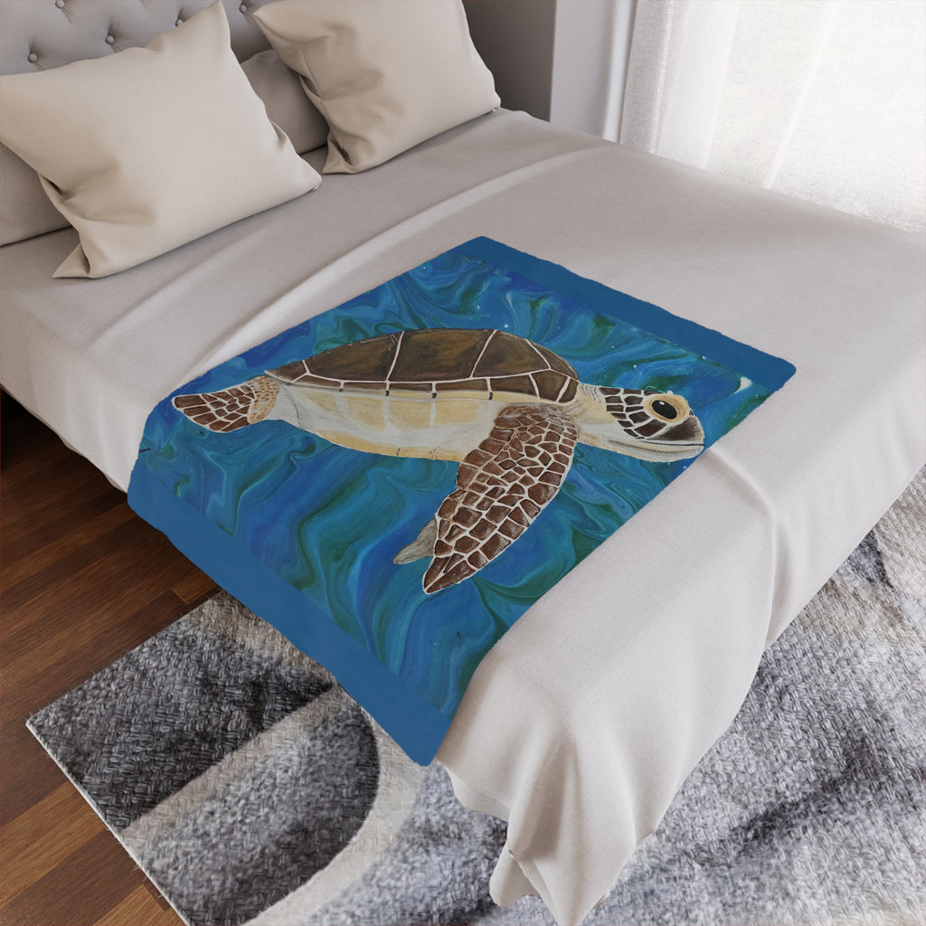Blanket with a turtle design on a bed in a bedroom setting