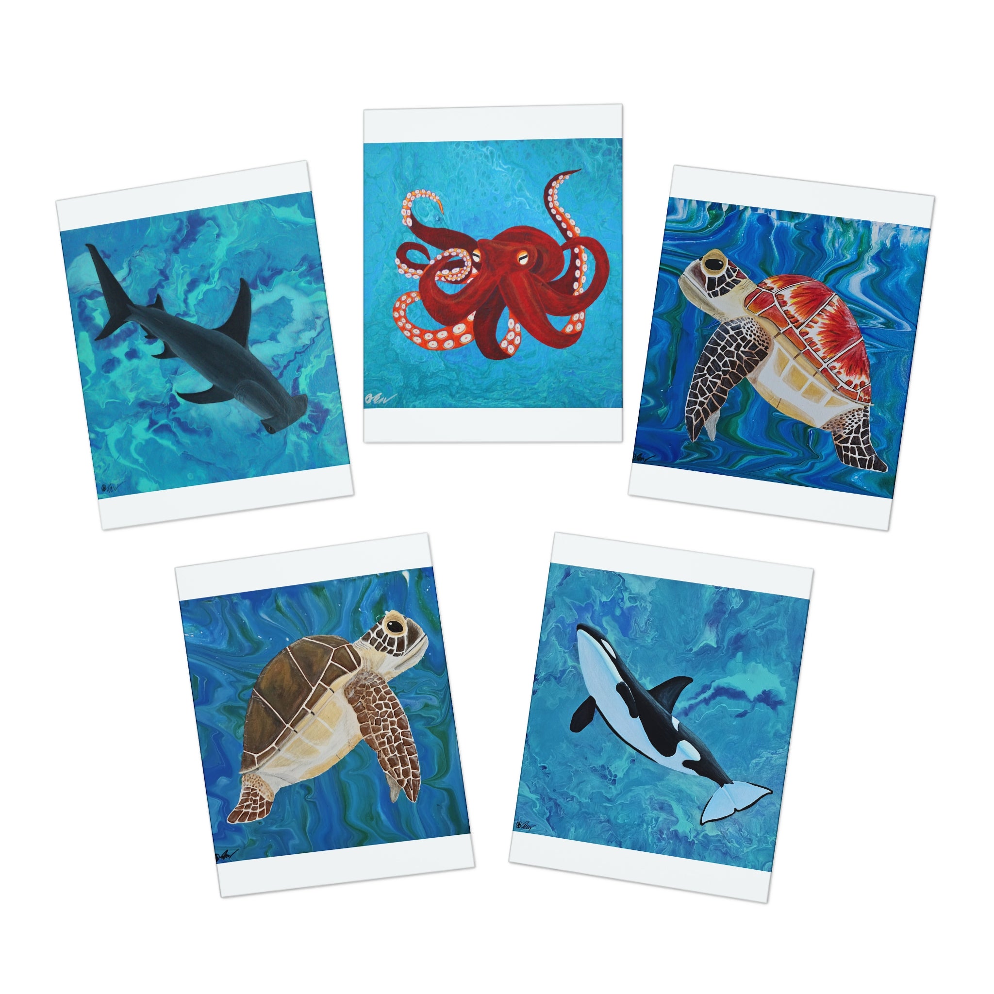 Set of five greeting cards featuring ocean animals on a white background