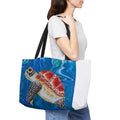 Person holding a tote bag with a turtle design on a white background