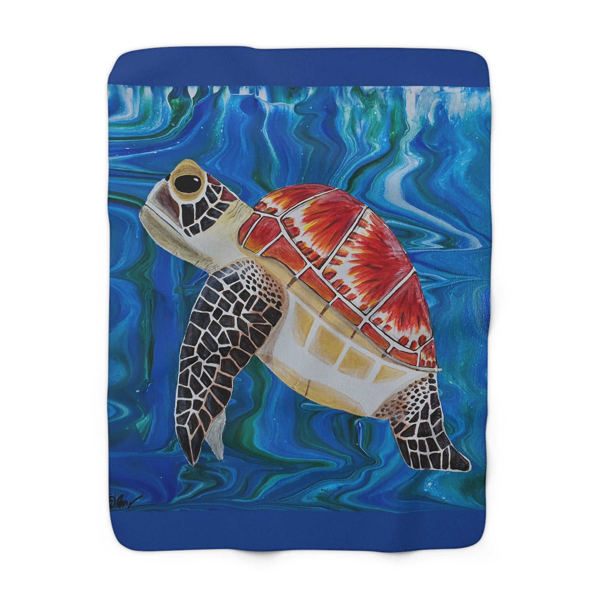 Fleece blanket with a turtle design on a blue background