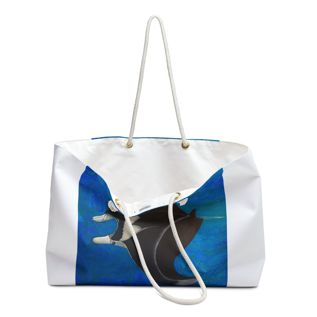 White tote bag with a blue and black abstract design on a white background