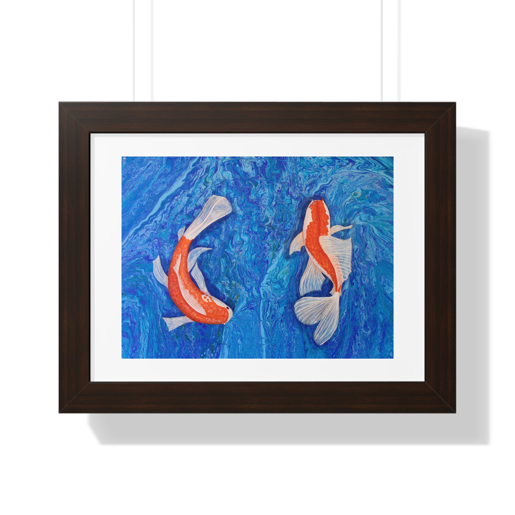 Framed artwork of two koi fish on a blue background