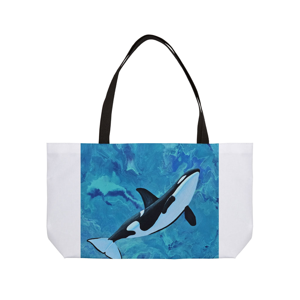 Tote bag with an orca whale design on a blue and white background