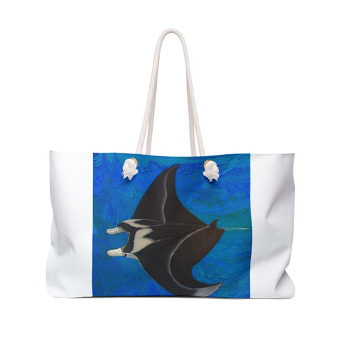 Tote bag with a manta ray design on a blue and white background
