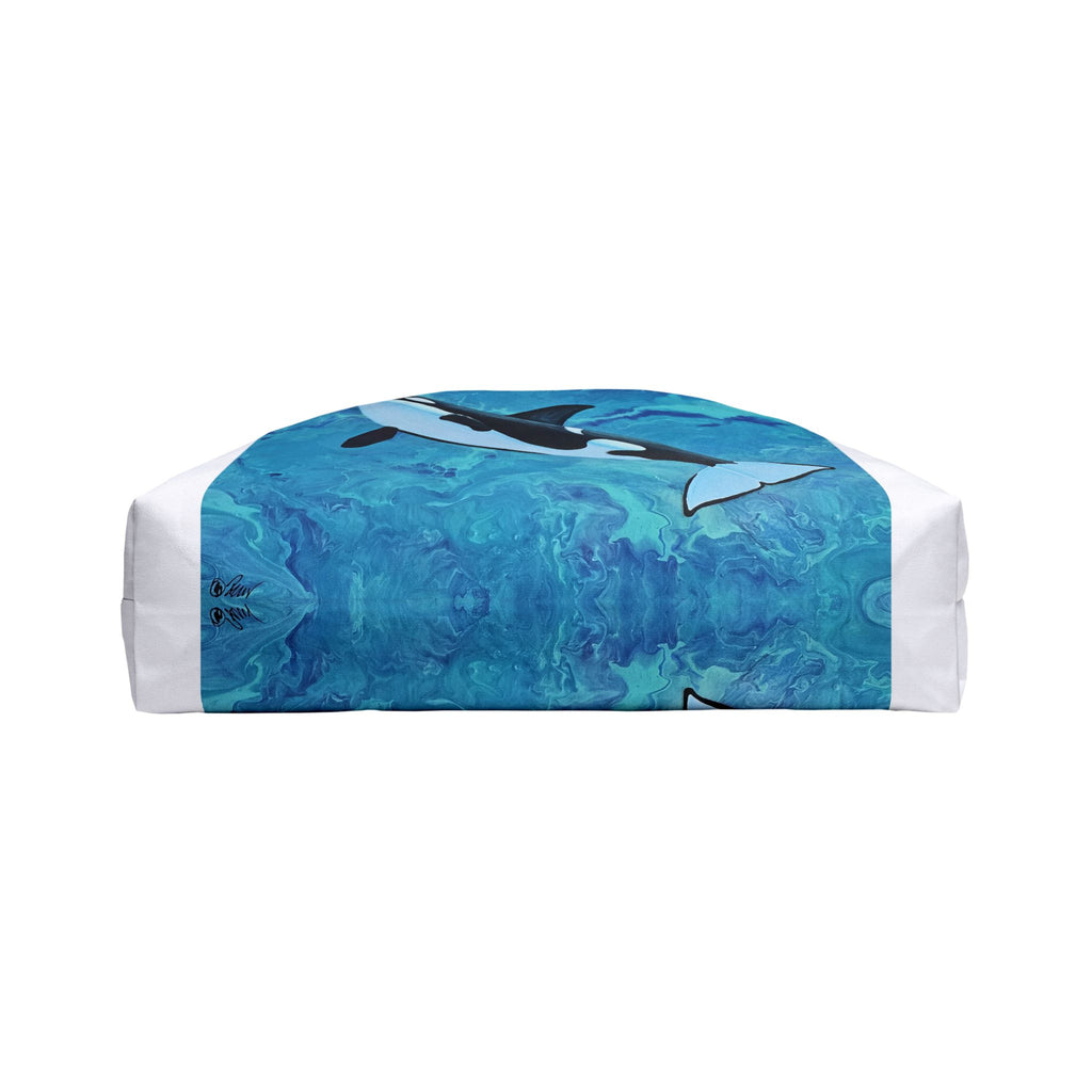 Bottom of bag with orca design on a blue and white patterned background