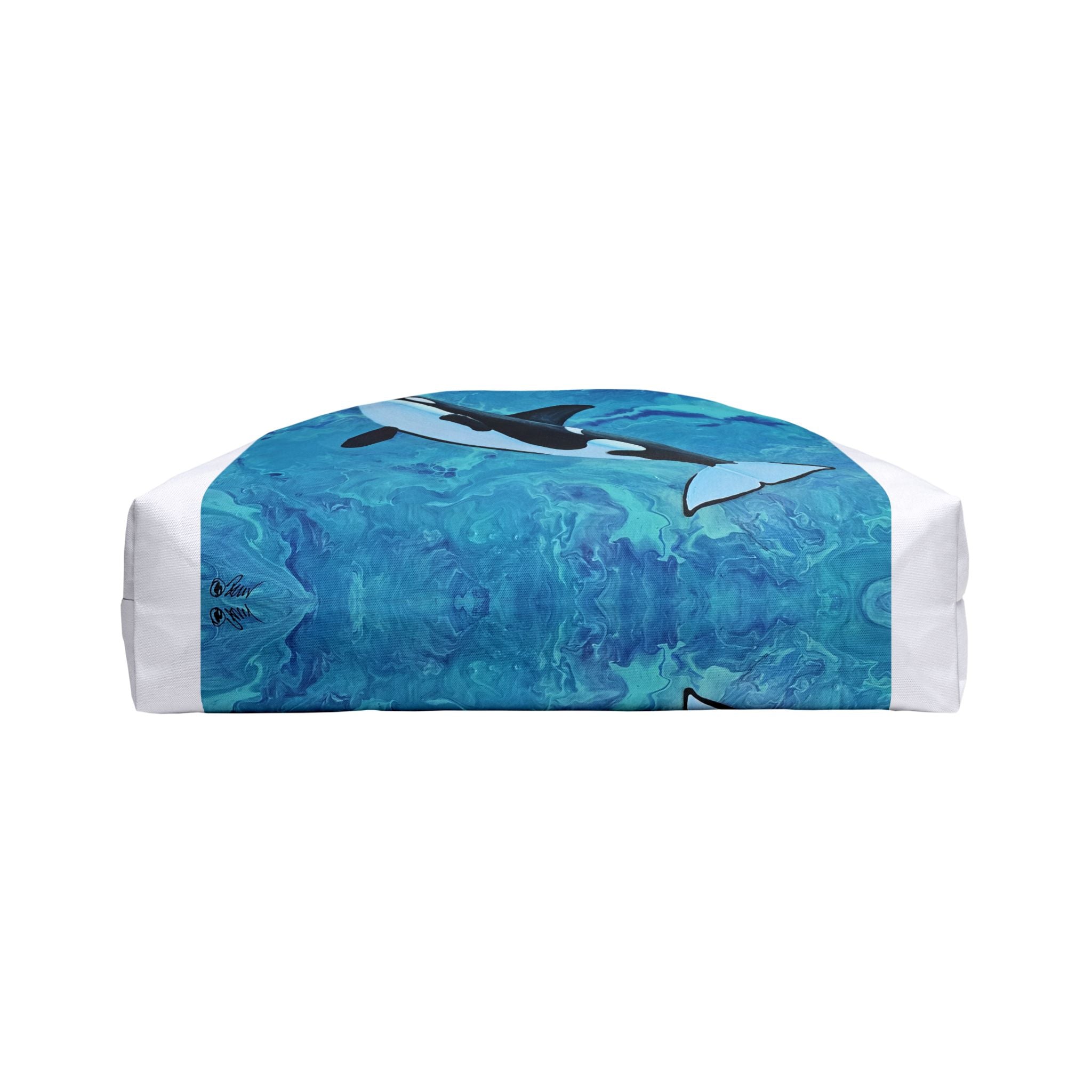 Bottom of bag with orca design on a blue and white patterned background