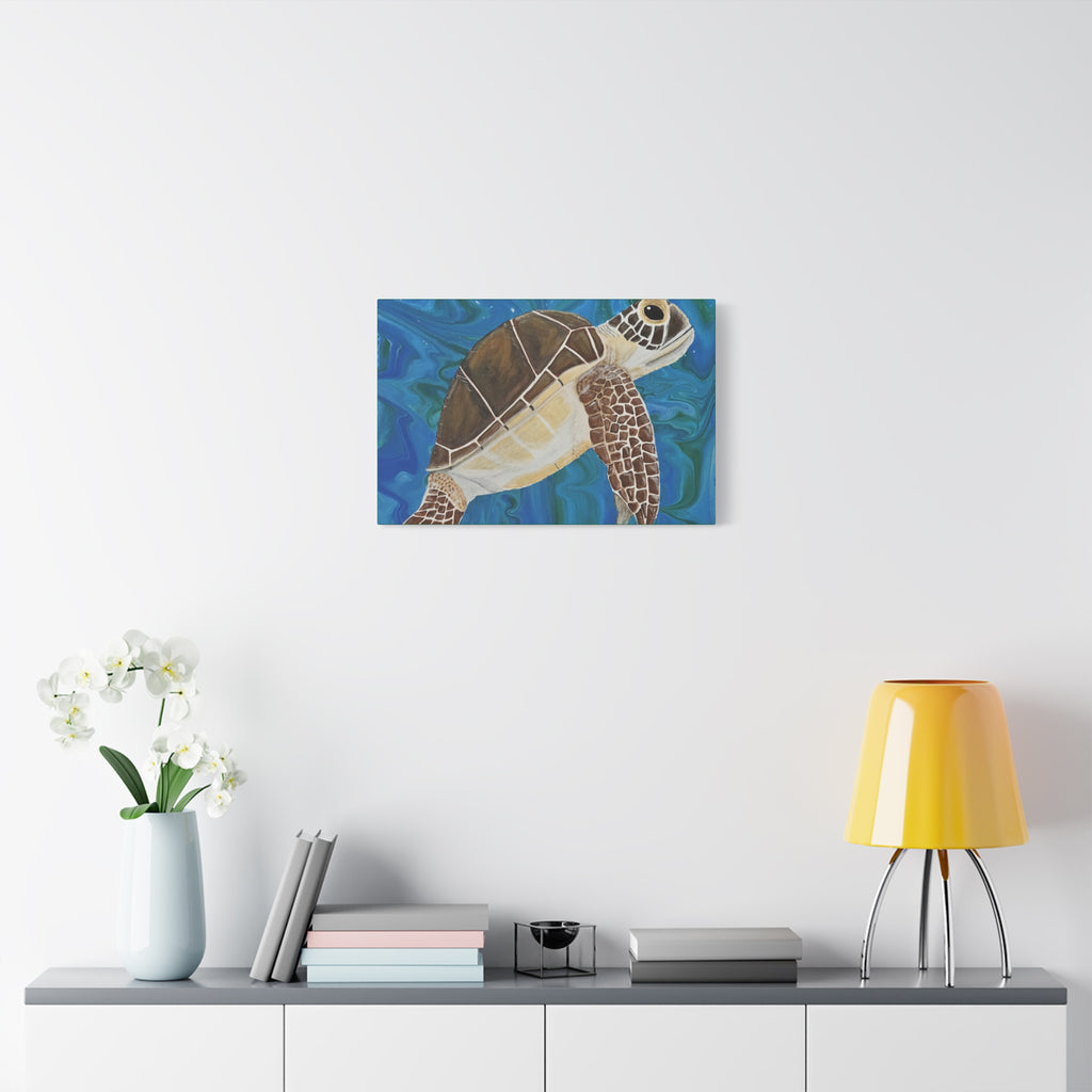 Canvas print of a turtle on a wall above a shelf with decor items.