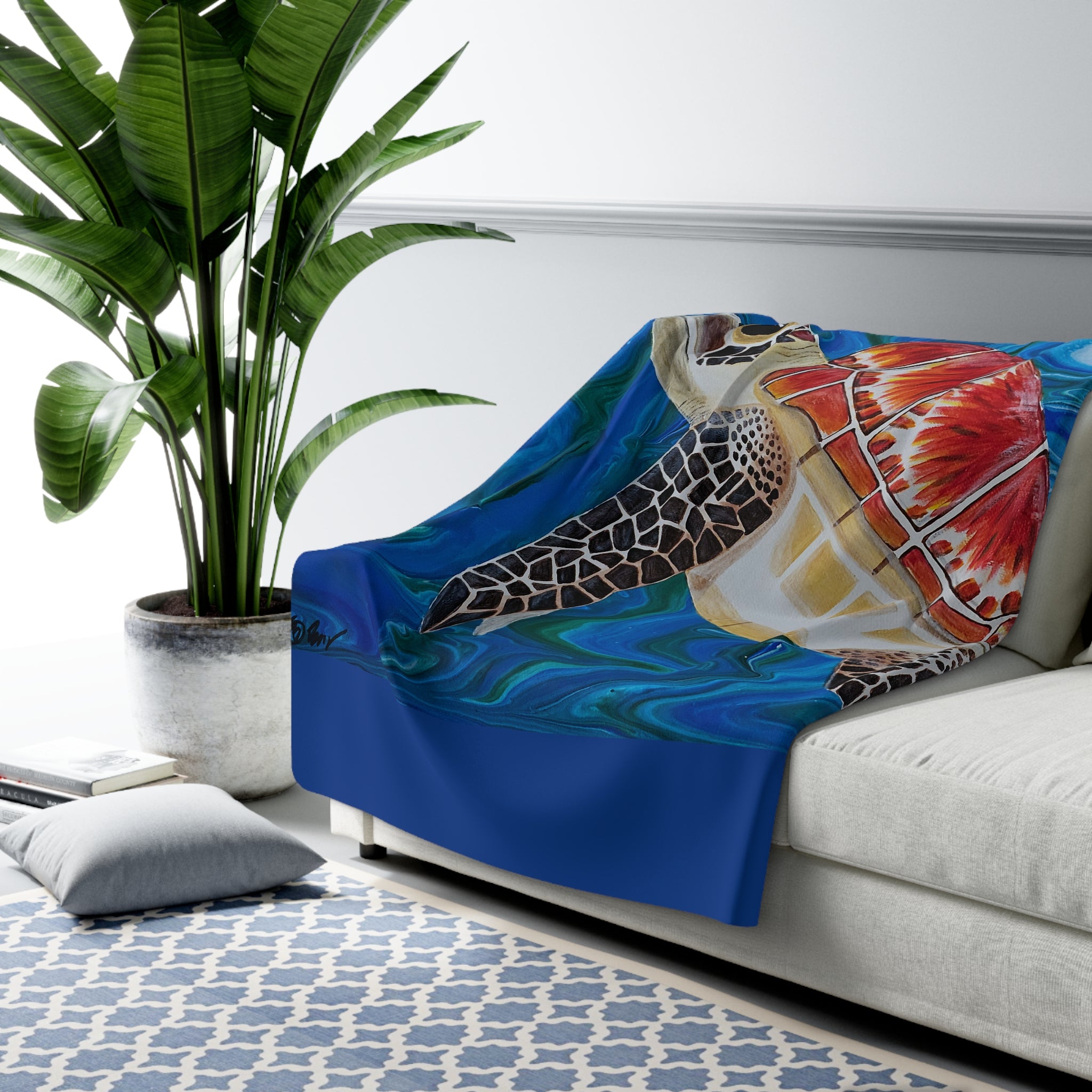 Colorful turtle-themed blanket draped over a sofa in a living room setting.